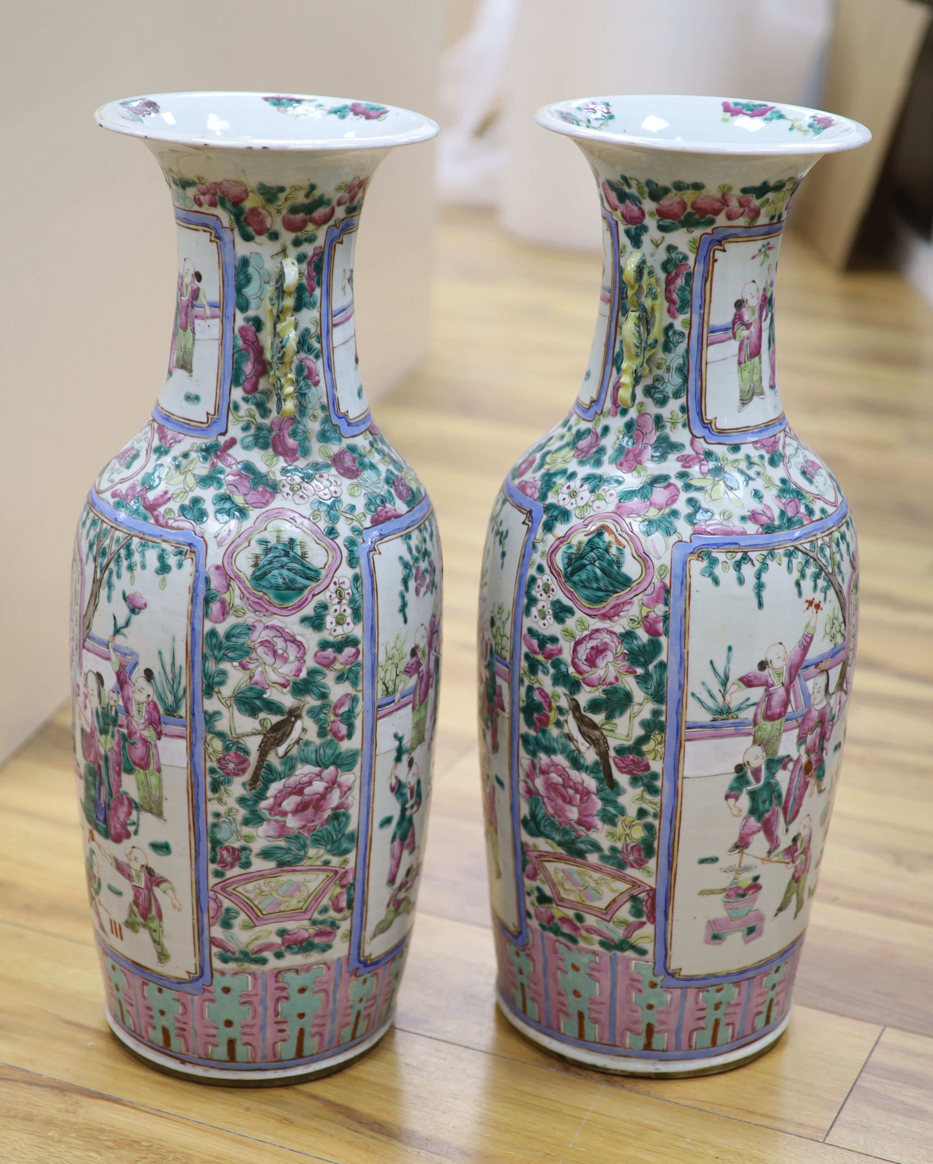 A pair of late 19th century Chinese large famille rose vases, height 61cm, one cracked